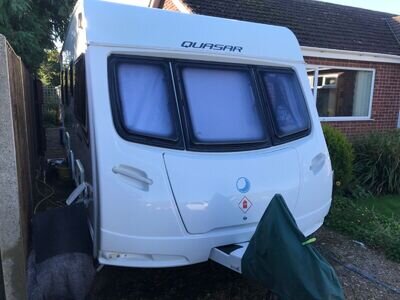 2013 Lunar Quasar 554 4 berth fixed bed touring caravan with Motor Mover