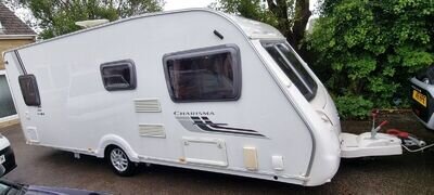 SWIFT CHARISMA 550 2010 4 BERTH FIXED BED CARAVAN WITH MOTOR MOVERS, ACCESSORIES