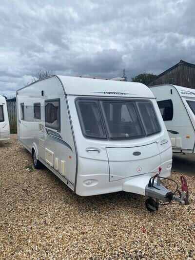 Coachman. 545/4. Fixed island bed. £8900