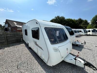 SWIFT CHARISMA 560 2010 MODEL 4 BERTH REAR WASHROOM TOURING CARAVAN