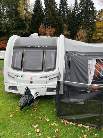 Coachman VIP 560 4 Touring caravan with awning on seasonal pitch at Faskally