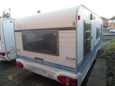 caravan hobby twin wheeler as been used as a site van for worker cheap to clear